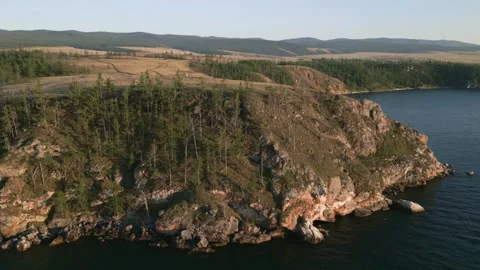 View of mountain rocks and blue clear water of the small sea of Lake Baikal Stock Footage 278443934