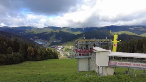 View from the mountain to the ski resort Bukovel and Zip Line Attraction, U.. Stock Footage 252275382