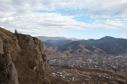 View from mountain to small town, rocks and stones, village in distance Stock Photos