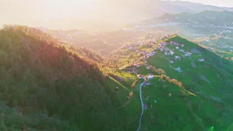 A view of a mountain with a small town on the side Stock Footage 273011756