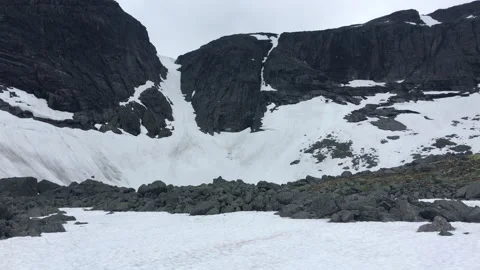 View of a mountain snow-covered pass and a range of mountains in the Khibiny Stock Footage 207684796