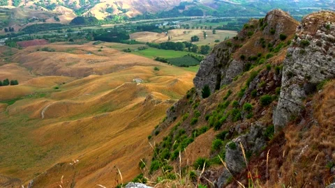 View from the mountain Te Mata Peak to the hills covered with yellow grass Stock Footage 131774367