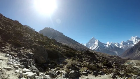 View of mountain valley between Tobuche and Ama Dablam mountains in Himalayas Stock Footage 125388670
