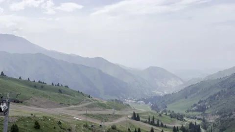 View of mountain valley down. Alpine ski resort in summer. Rest in mountains Stock Footage 200127955