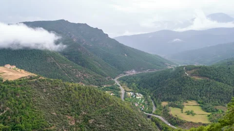 View of a mountain valley with its changing weather in the Pyrenees of Catalonia Vídeos de archivo 315236993