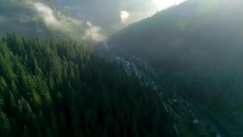 View to mountain village through thick mist, mountain Stock Footage 321133025