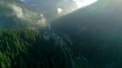 View to mountain village through thick mist, mountain Stock Footage 321428271