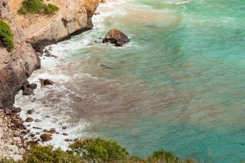 View from the mountain to the waves of the sea. Stock Photos