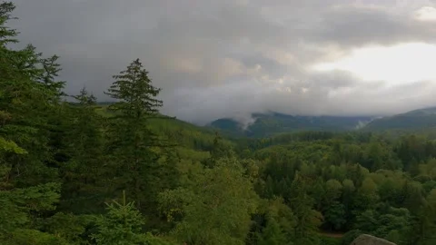 View of the mountains against the background of moving clouds when the weathe Stock Footage 229404895