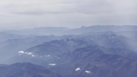 View of the mountains from the aircraft Stock Footage 261708443