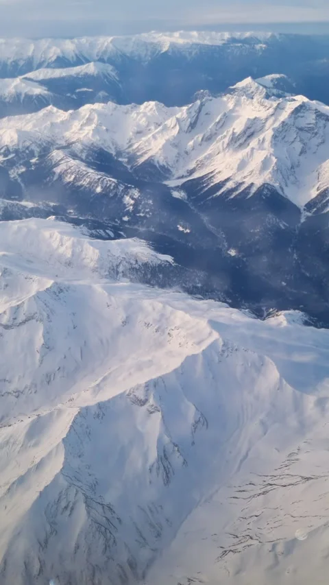 A view of the mountains from an airplane window. Caucasus Mountains, Russia. Stock Footage 269912296