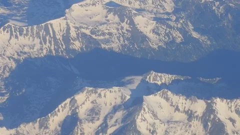 View of mountains from an airplane window in slow motion 60fps Stock-Footage 290097371