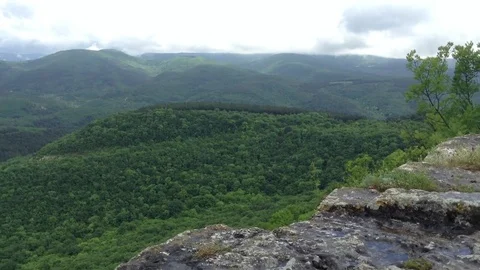 View of mountains and clouds and a trees at Mangup Kale - Crimea , Russia Stock Footage 73765999