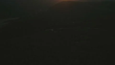 View of mountains and clouds at golden hour sunset with beams of the sunlight Video stock 108107518