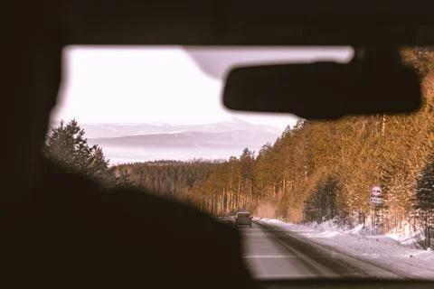 View on mountains and forest from inside the car Stock Photos
