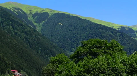  view of the mountains and paragliding Stock Footage 68446565