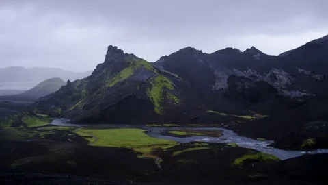 View Of Mountains And River Flowing Through Valley On A Stormy Day In Iceland Video stock 82562057