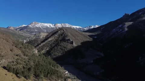 A view of the mountains and valley with snow capped mountains Video stock 328615487