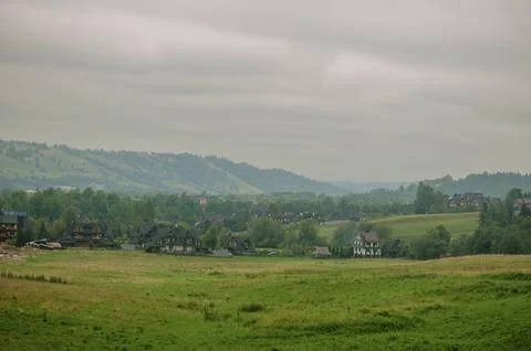 View of mountains and valleys in cloudy weather in early autumn Stock Photos