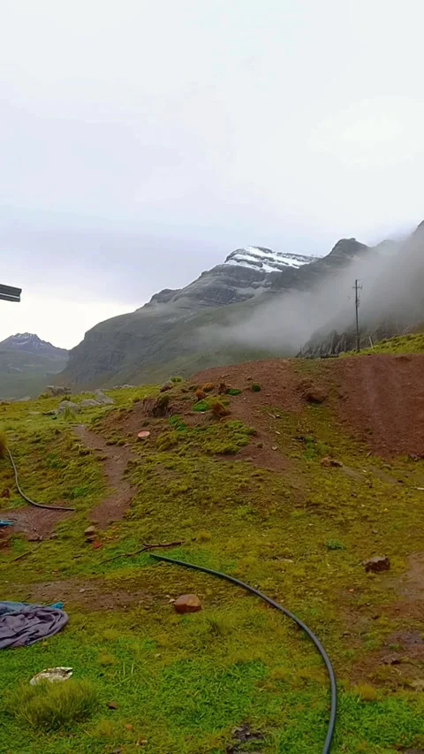 View of mountains in the Andes, a mountain with snow on its peak in a rural sett Stock Footage 320057079