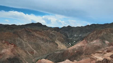 View of the mountains of the canyon with a river in the gorge Video stock 237973900