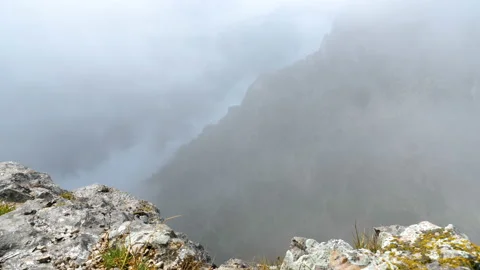 View of the mountains from the edge of the cliff. Video stock 97735282