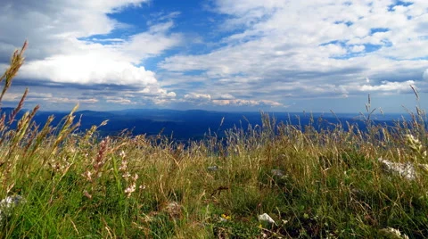 View from mountains with grass swaing in wind. Time lapse Stock Footage 55811045