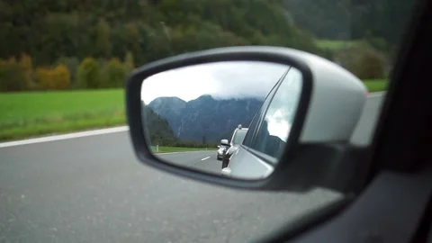 View of mountains in a mirror of a car Stock Footage 218314635