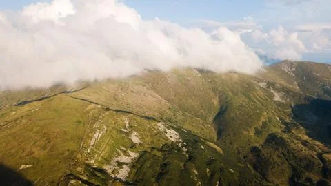 View of the mountains range in clouds from a bird's eye view Stock Photos
