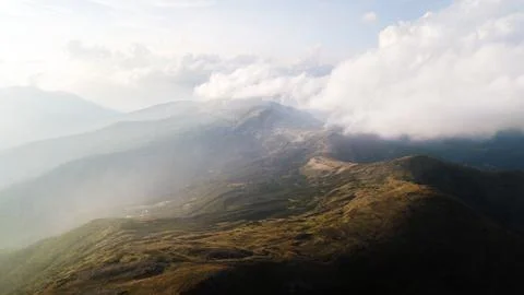 View of the mountains range in clouds from a bird's eye view Stock Photos