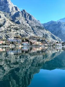 View of the mountains reflected in the crystal clear water of the Bay of Ko.. Stock Photos