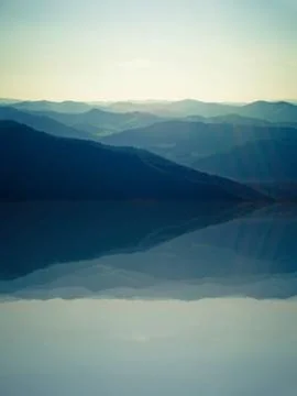 View from mountains with reflection in lake Stock Photos