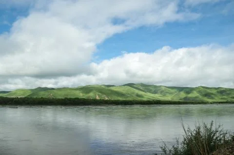 View of Mountains on the Riverside Stock Photos