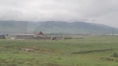 View of mountains, road and small town from the moving transport Stock Footage 168310857