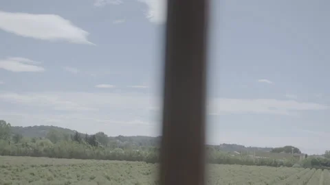 View Of Mountains Through A Window - No LUT Version Stock Footage 222375078