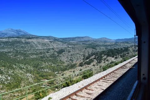 View of the mountains through the window of the train Stock Photos