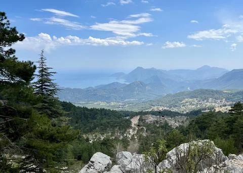 View of mountains, trees, and the distant sea from the Lycian Way in Antalya Stock Photos