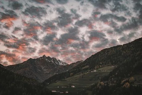View of mountains under a cloudy sky in early morning Stock Photos