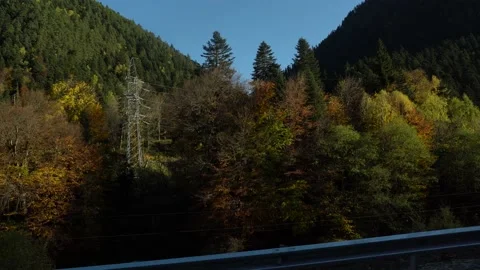View from mountains to valley in sunset behind trees 4K footage Stock Footage 120737284