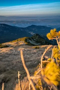 A view from the mountains to the valleys below at sunset Stock Photos