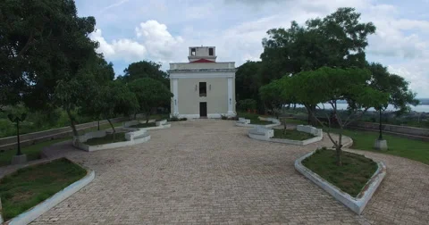 View into the movement of park zone, trees and walking path to an ancient chapel Stock Footage 68075869