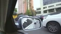 View from moving automobile, reflection in rearview mirror. Traffic jam in city 4k or 4k+ Resolution