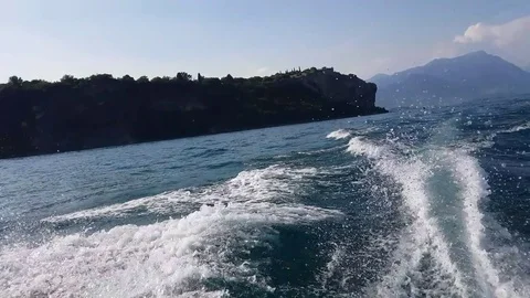 View from a moving boat engine o a lake Stock Footage 77070788