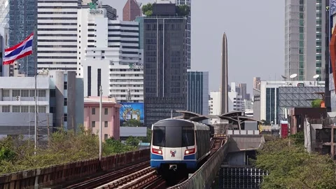 View of moving BTS skytrain at Victory Monument metro station. Stock Footage 278915872