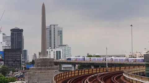 View of moving BTS skytrain at Victory Monument metro station. Stock Footage 282907741