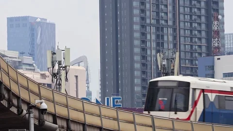 View of moving BTS skytrain at Victory Monument metro station. Stock Footage 282915511