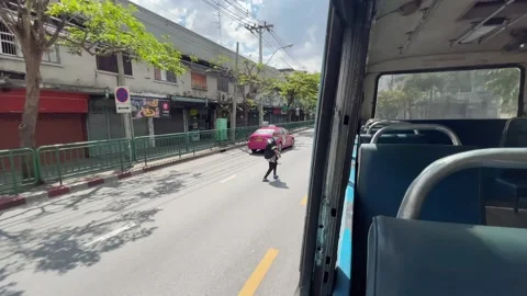 View from the moving bus window with empty seats and road on a sunny day Stock Footage 171764721