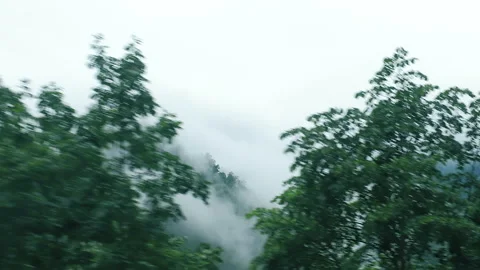 View from moving car of the cloud-covered mountains. Journey. Durmitor park Video stock 274874032