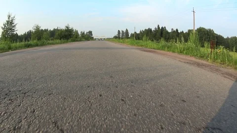 View from a moving car on a paved road Stock Footage 71814817
