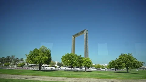 A view from a moving car on Sheikh Zayed Road, showcasing the Dubai Frame i.. Stock Footage 297938277